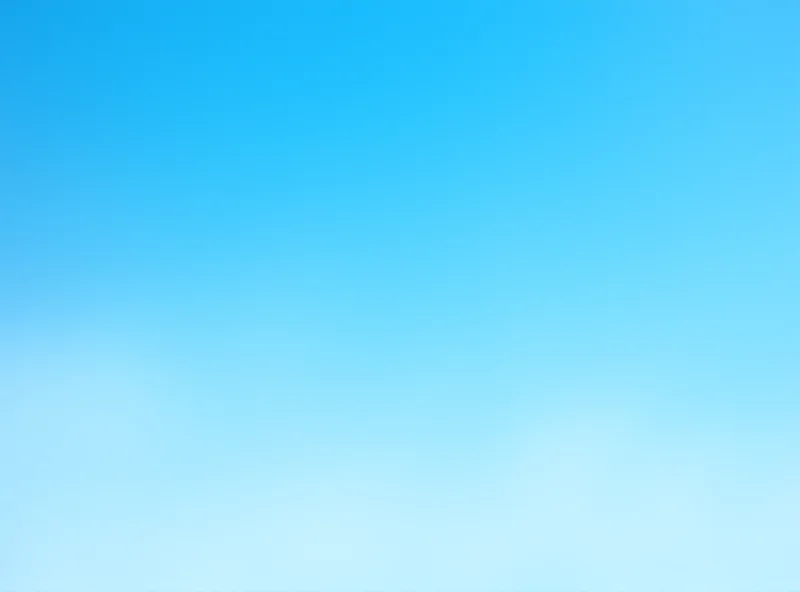 An airplane taking off against a bright blue sky, with the tail fin clearly showing the IAG logo.