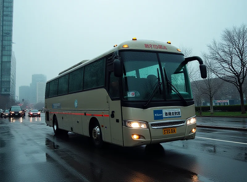 A coach bus parked on a city street in Wuhan, China. The bus has a sign indicating it's transporting medical personnel or supplies.