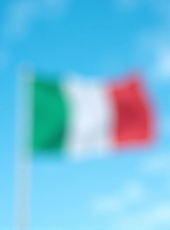 Italian flag waving in the wind against a blue sky