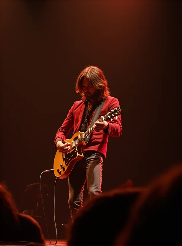 Joey Molland performing on stage with Badfinger in the 1970s, playing his guitar with energy and passion.