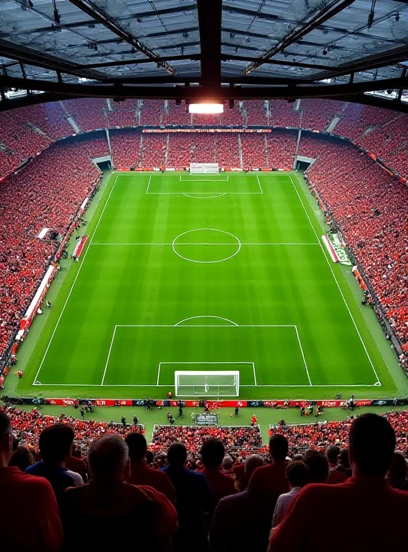 An overhead view of Anfield stadium during a Liverpool Premier League match, with fans cheering in the stands.