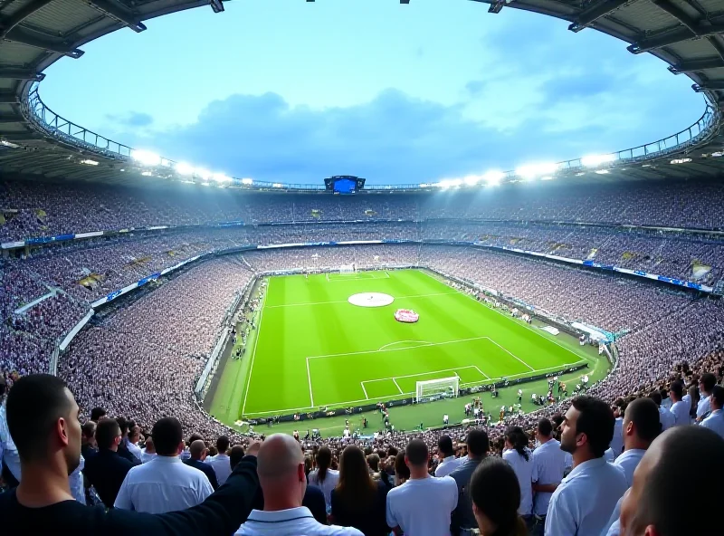 A wide shot of the Santiago Bernabéu stadium during a Real Madrid game, with fans visible in the stands.